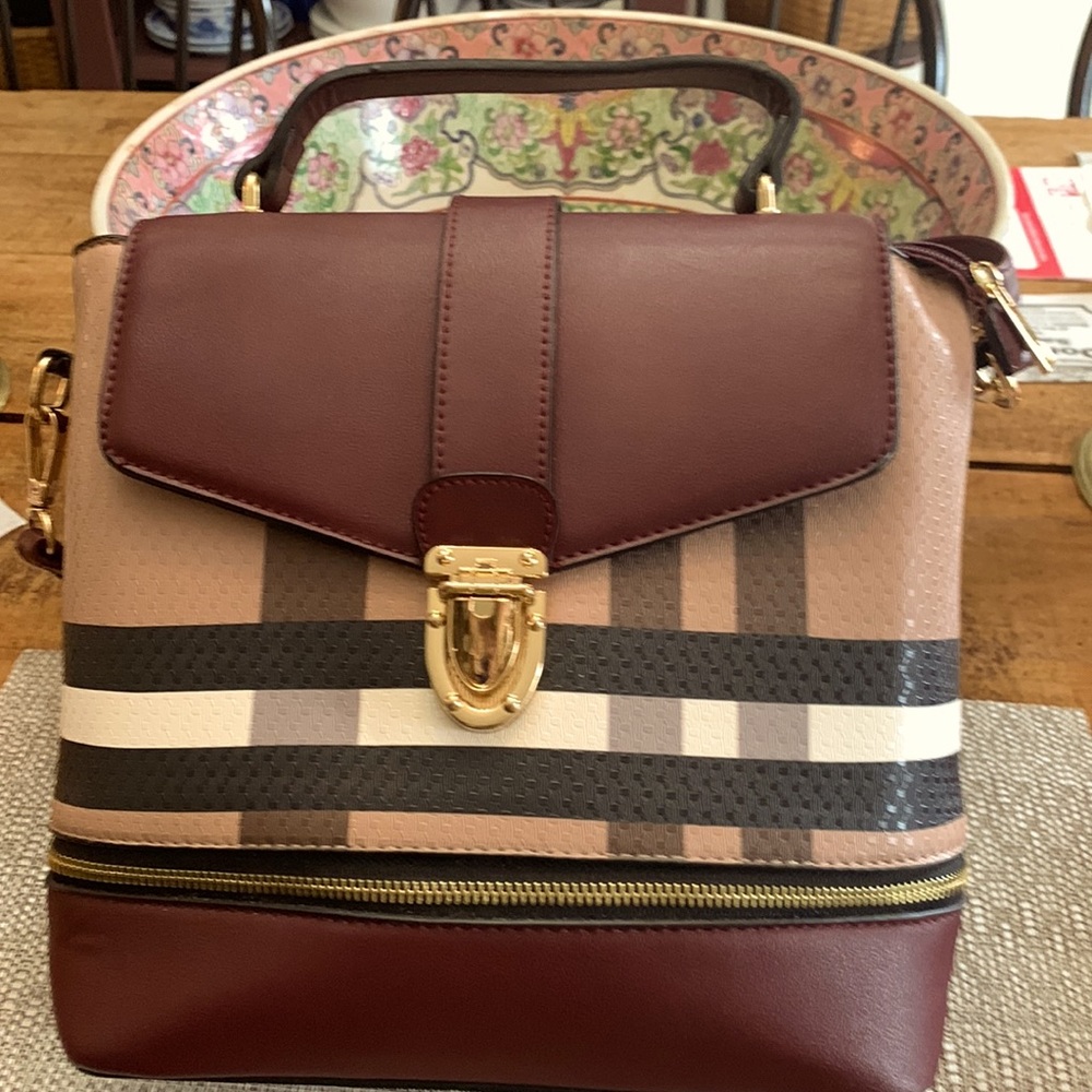 Lovely neutral colored plaid bag. Crossbody or backpack with matching wallet.